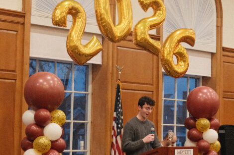 Senior and member of Chi Phi, Alex Brown speaking at 100 Nights