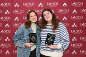 Hope Basaman (Alpha Phi) and Katie Simpson (Alpha Gamma Delta) receive the Eleanor Winkey Prize
